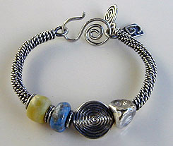 Bangle bracelet of sterling silver, lapis lazuli, and verd-antique stones - by Vicky Jousan