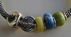 Bangle bracelet of sterling silver, lapis lazuli, gaspeite, and verd-antique stones - by Vicky Jousan