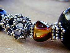 Jet, Amber, and Sterling Silver necklace, bracelet and earrings by Vicky Jousan