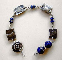 Lapis Lazuli and Sterling Silver Power Symbols Pendulum Bracelet by Vicky Jousan