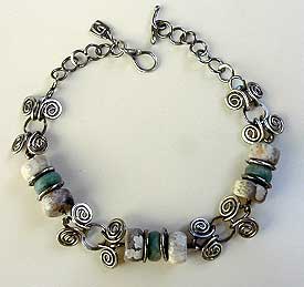 Hand carved stones and sterling silver necklace by Vicky Jousan
